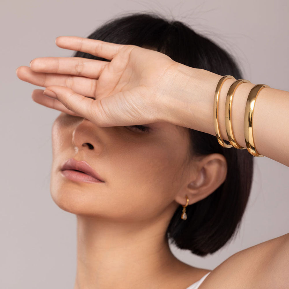 Elliptical Grace Gold Bangle Bracelet