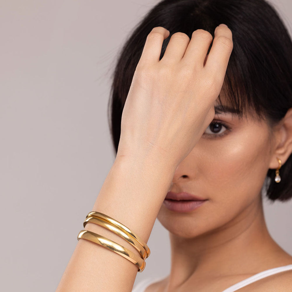 Elliptical Grace Gold Bangle Bracelet