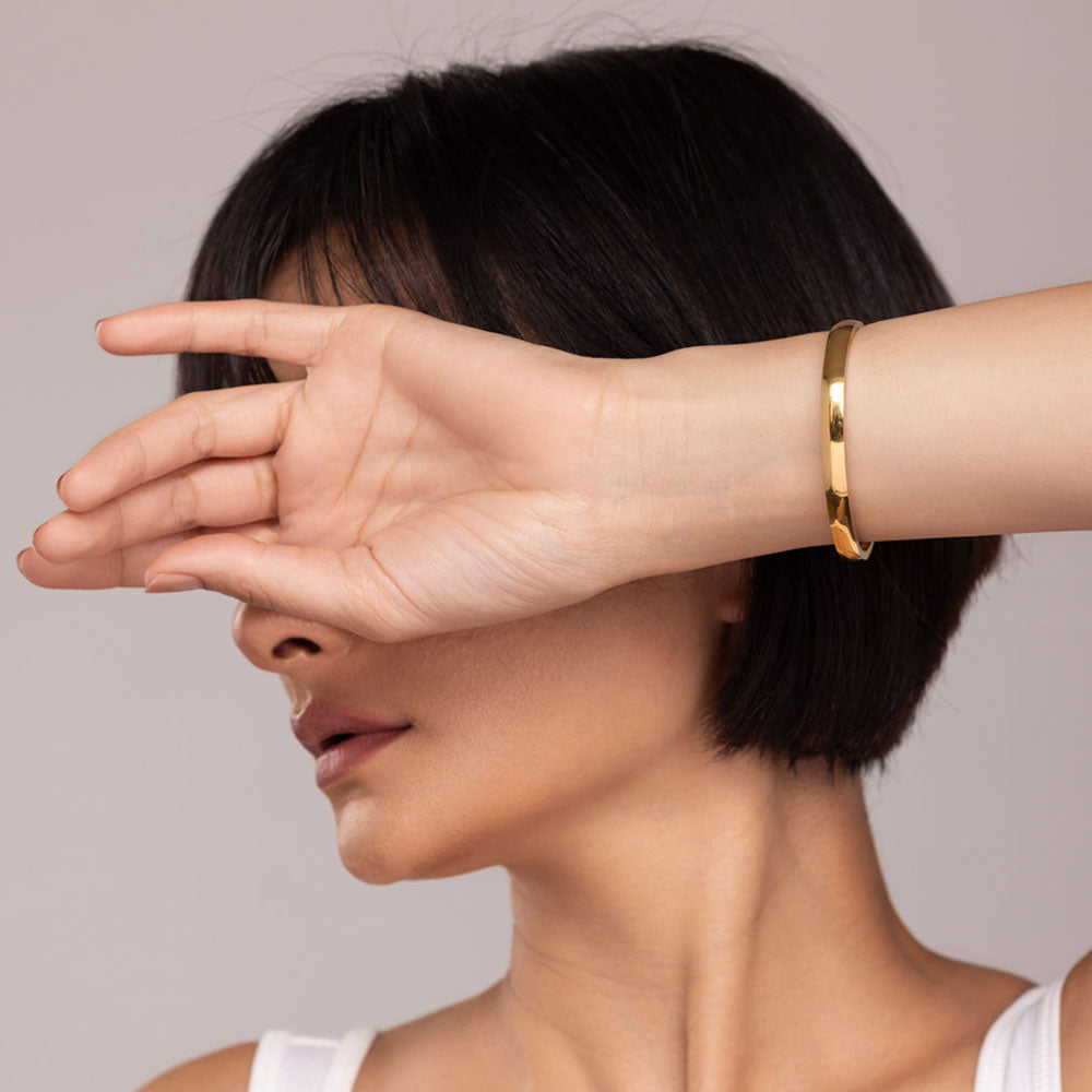 Elliptical Grace Gold Bangle Bracelet
