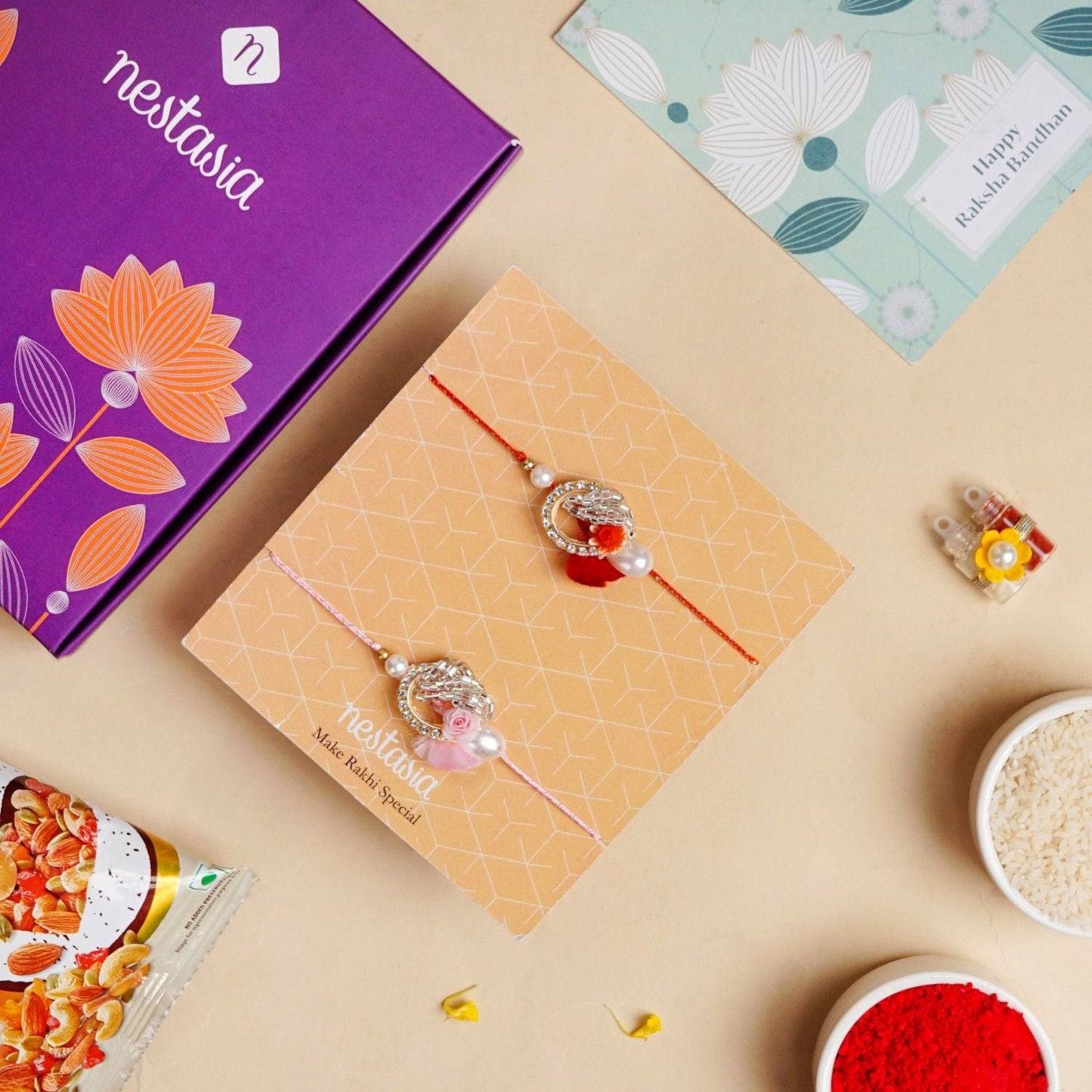 Rose and Pearl Set Of 2 Rakhi Gift Set