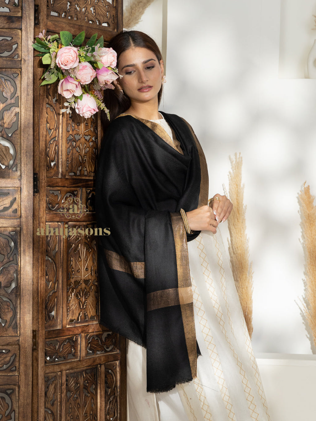 Black Handloom Pure Pashmina Shawl rendered in Contrast In Zari Border