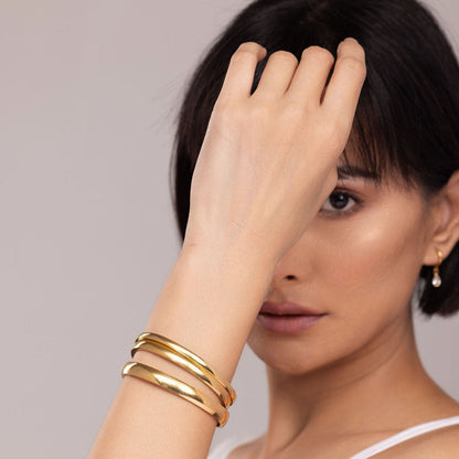 Elliptical Grace Gold Bangle Bracelet