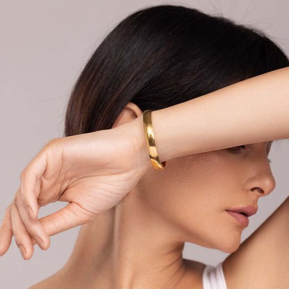 Elliptical Grace Gold Bangle Bracelet