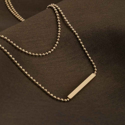 Gilded Whispers Dainty Gold Layered Necklace